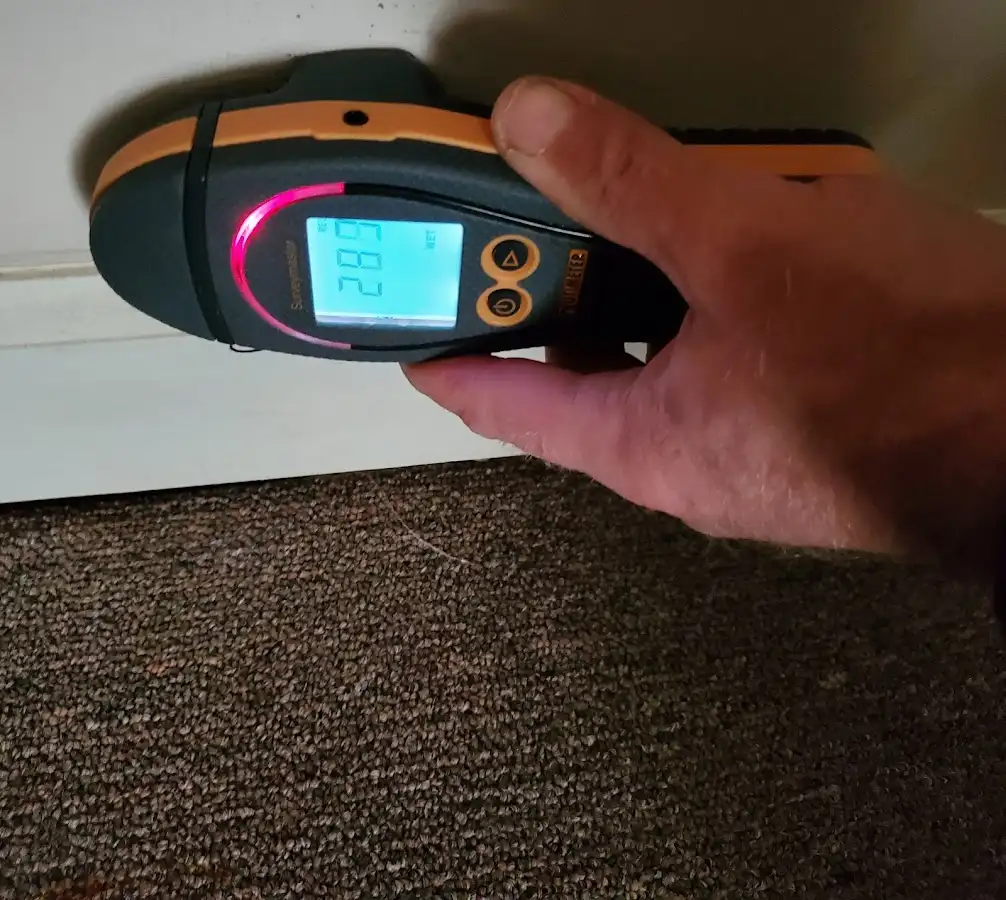 Moisture detection at baseboard during Storm Damage Restoration in Oconomowoc